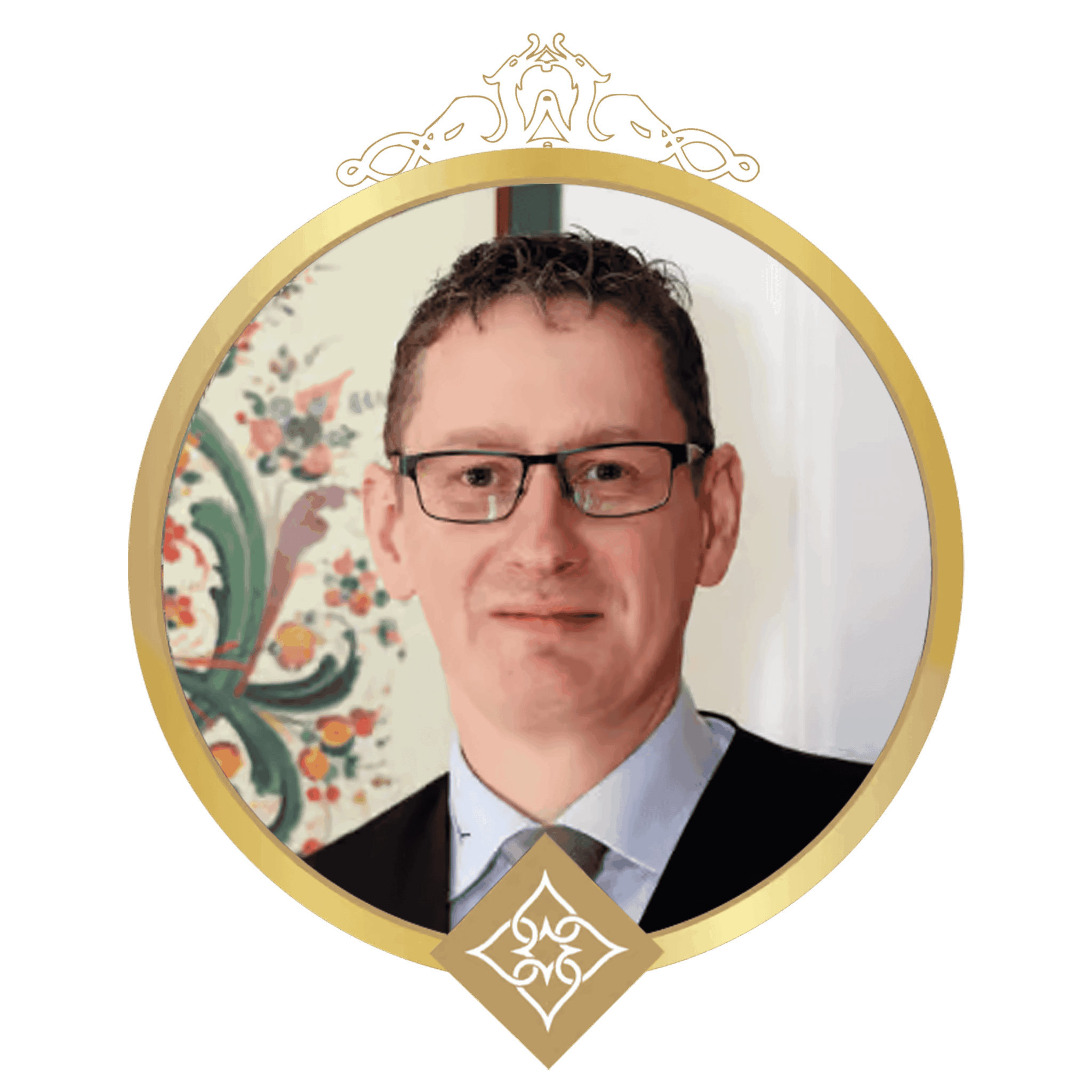 Portrait of a man in a suit and glasses inside a gold circular frame with decorative crown at top and a diamond emblem at bottom.