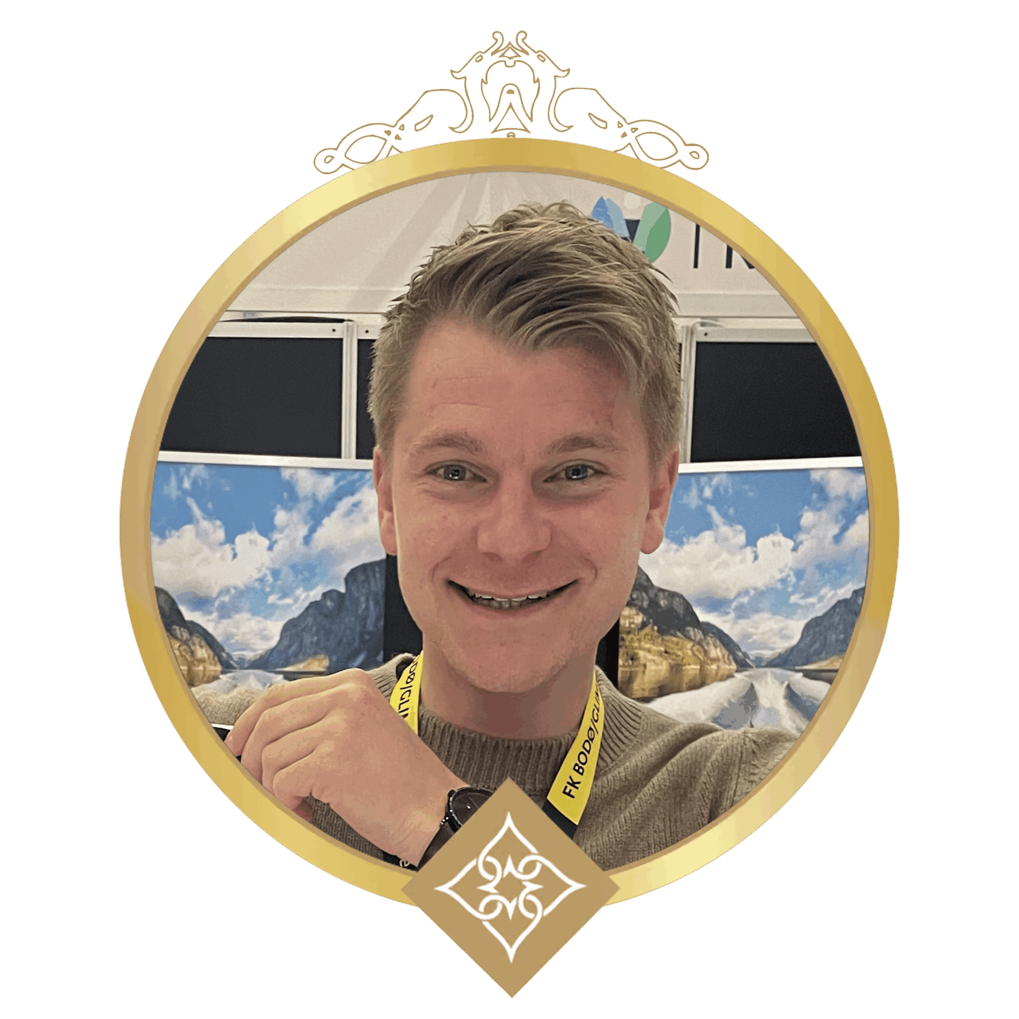 Smiling man portrait inside a gold circular frame with a crown decoration at the top and a decorative diamond emblem below, wearing a yellow lanyard.