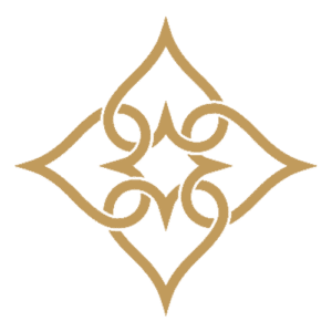 Decorative gold diamond-shaped ornament with intricate symmetrical loops on a green background.